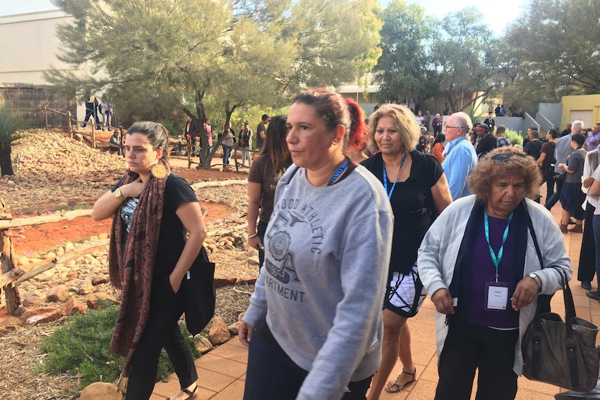 Several people seen leaving the talks in Uluru with stern faces