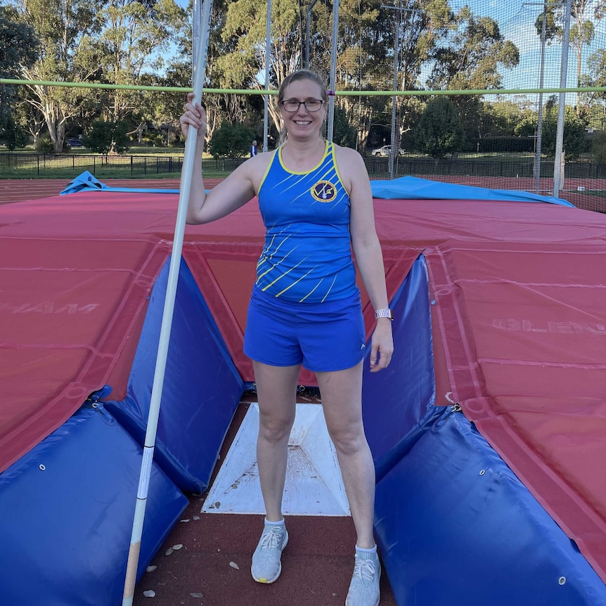 A women with a pole vault.