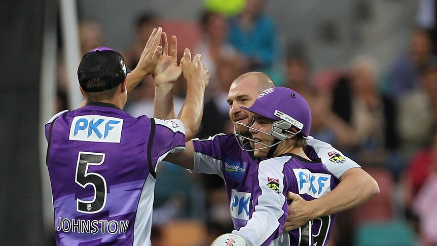 Well done ... Jason Krejza (C) celebrates with team-mates after taking the wicket of Chris Gayle (Hamish Blair: Getty Images)