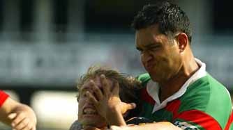 Brett Hodgson of the Tigers tackled by Lee Hookey of the Rabbitohs
