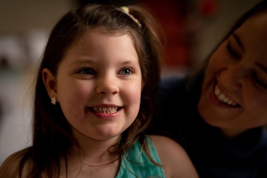 A young girl smiling