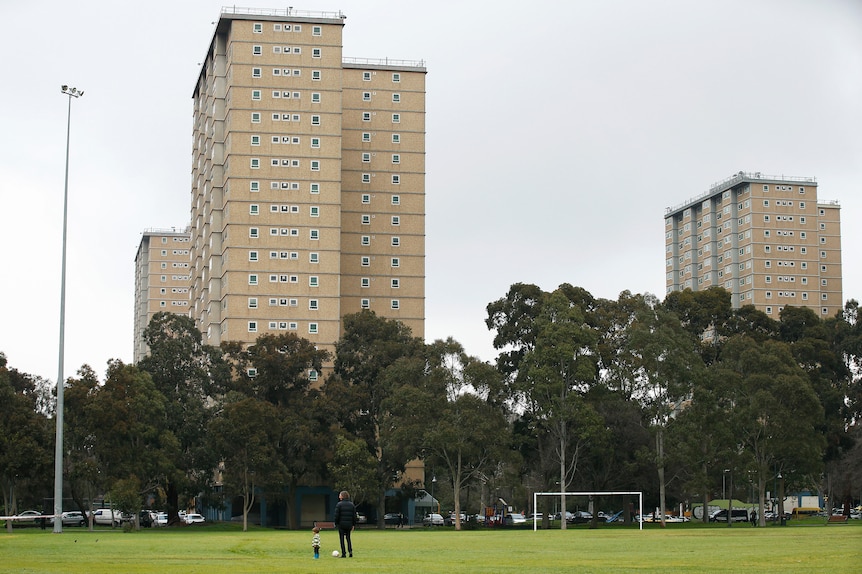 Melbourne public housing with man and child in front