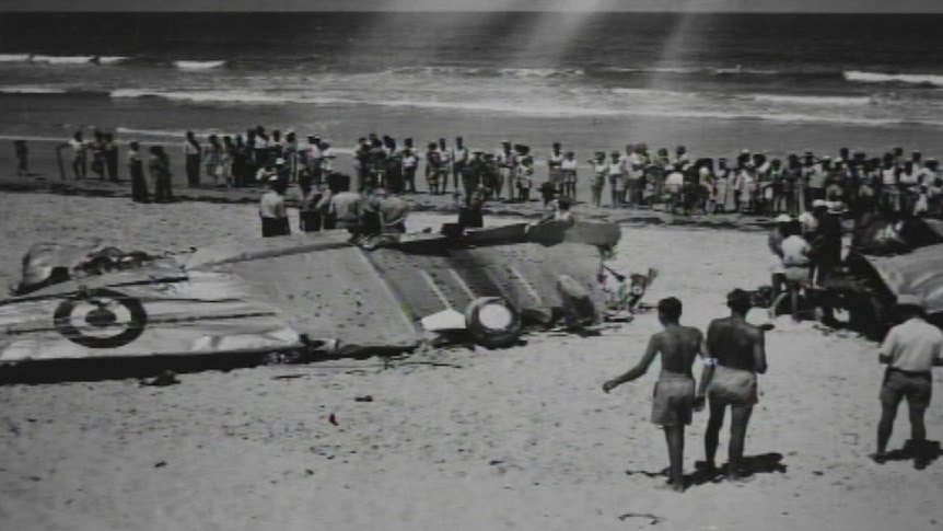 The wreckage of the RAAF Wirraway after it crashed on Maroochydore Beach in 1950.
