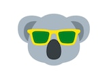 The emoji of a koala wearing green and gold sunglasses.