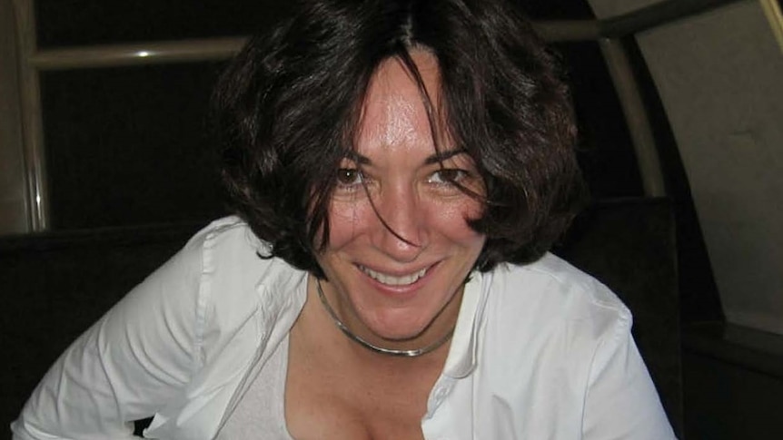 Ghislaine Maxwell in a white shirt, grinning at the camera 