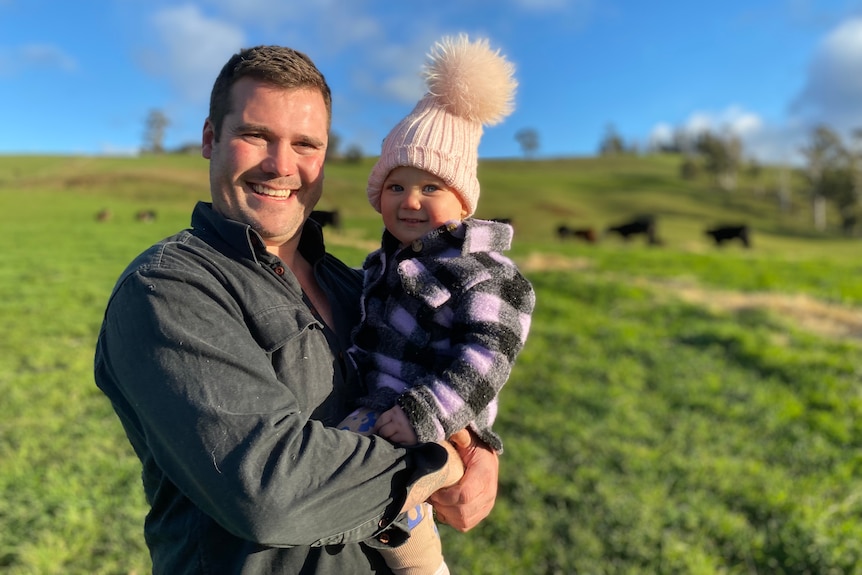 Wade von Stieglitz with one of his young daughters on his farm.