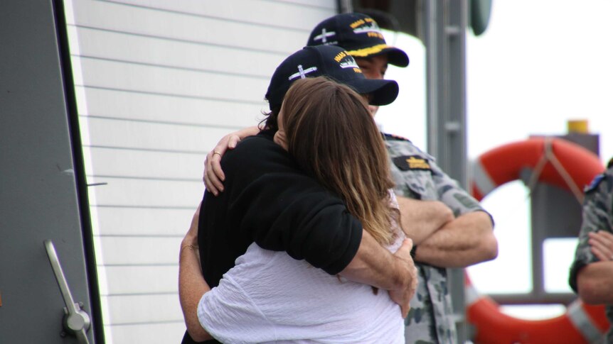 Gregor McGuckin embraces his  partner, Barbara O'Kelly.