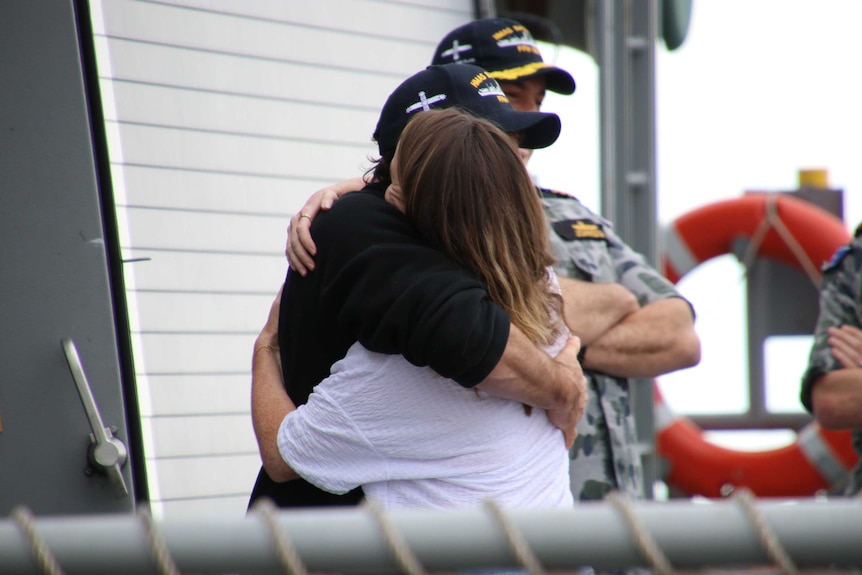 Gregor McGuckin embraces his  partner, Barbara O'Kelly.