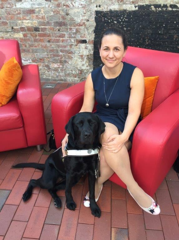 Sara Waitzer who is visually impaired with her guide dog Pepper
