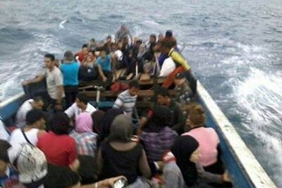 Asylum seekers on board a boat that later sank 50 metres off the Indonesian coast in September 2013.