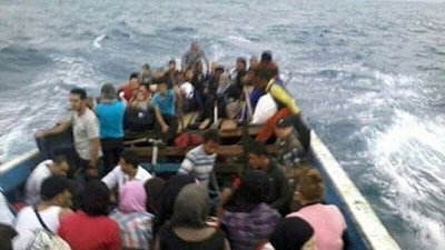 Asylum seekers on board a boat that later sank 50 metres off the Indonesian coast in September 2013.