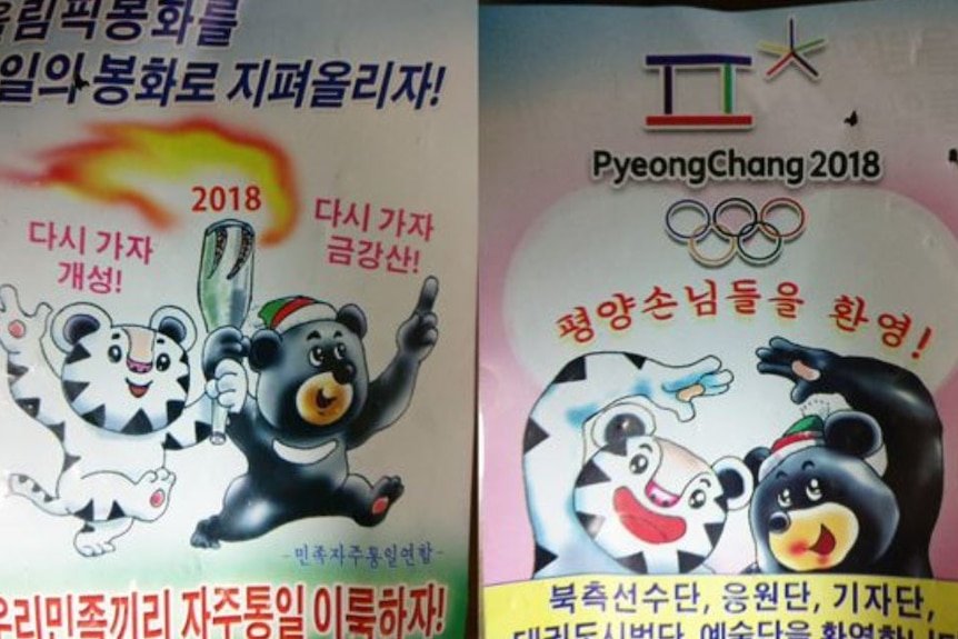 North Korea propaganda posters show Winter Olympics mascots carrying an olympic torch and slogans written in North Korean.