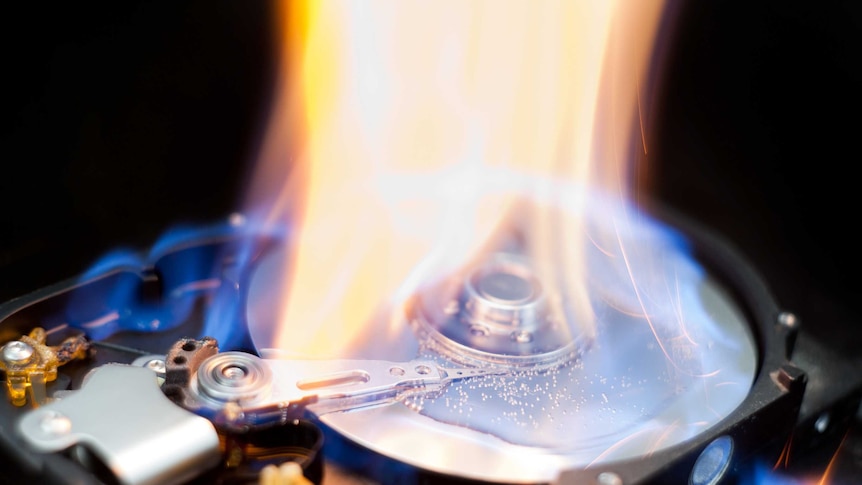 A computer hard drive on fire