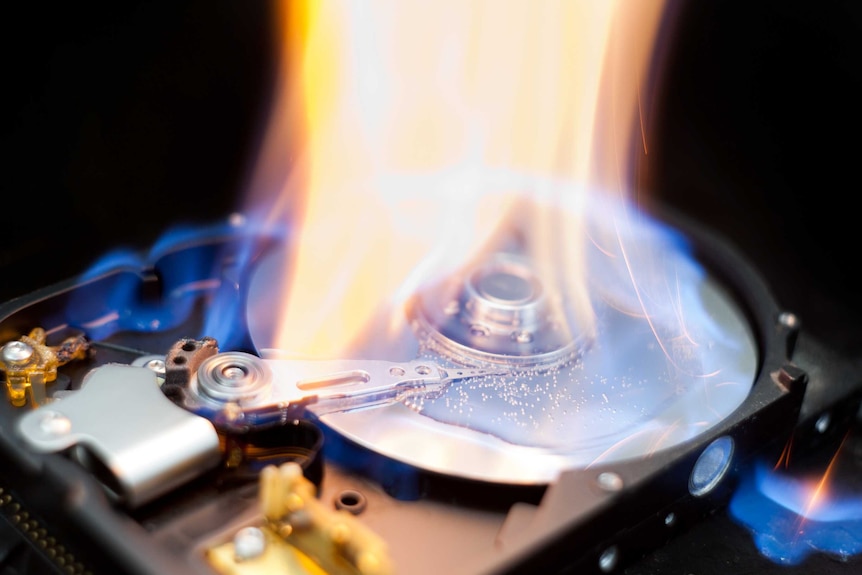 A computer hard drive on fire