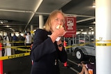 Chief Health Officer Jeannette Young tucking into a sausage at Bunnings vaccination hub on Saturday.