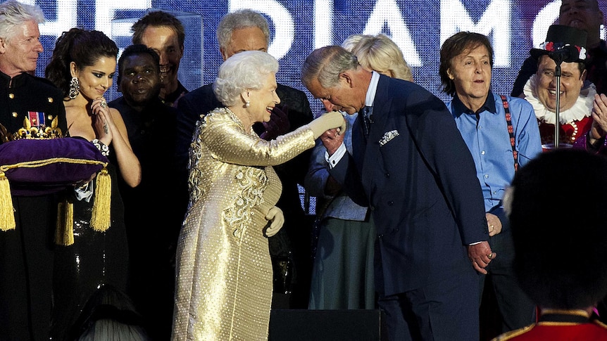 Prince Charles kisses the hand of Queen Elizabeth II after the Queen's Diamond Jubilee Concert.