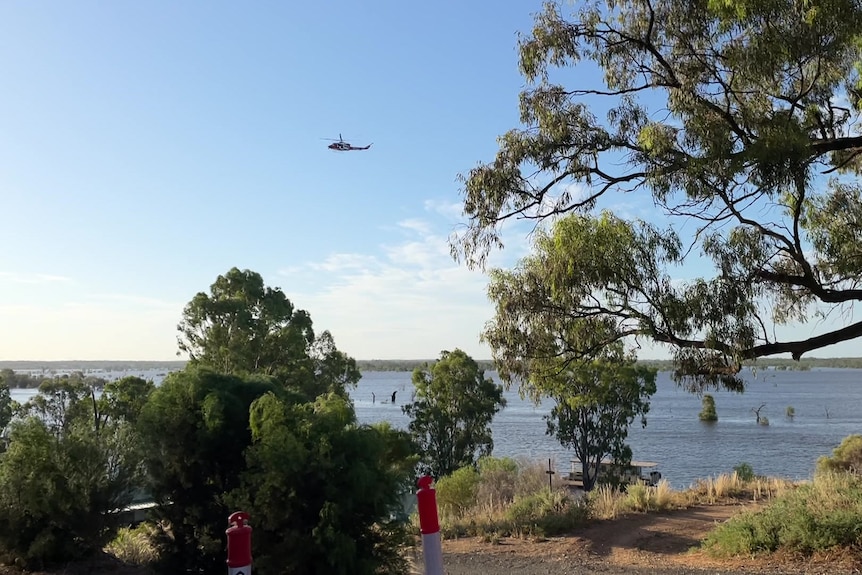 A helicopter above the River Murray.