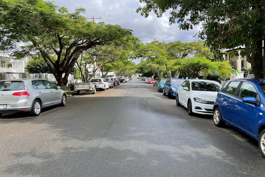 Suburban street filled with cars