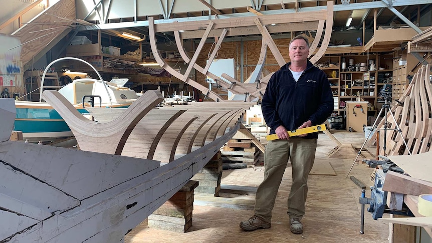 Tasmanian boatbuilder Andrew Denman in his workshop.