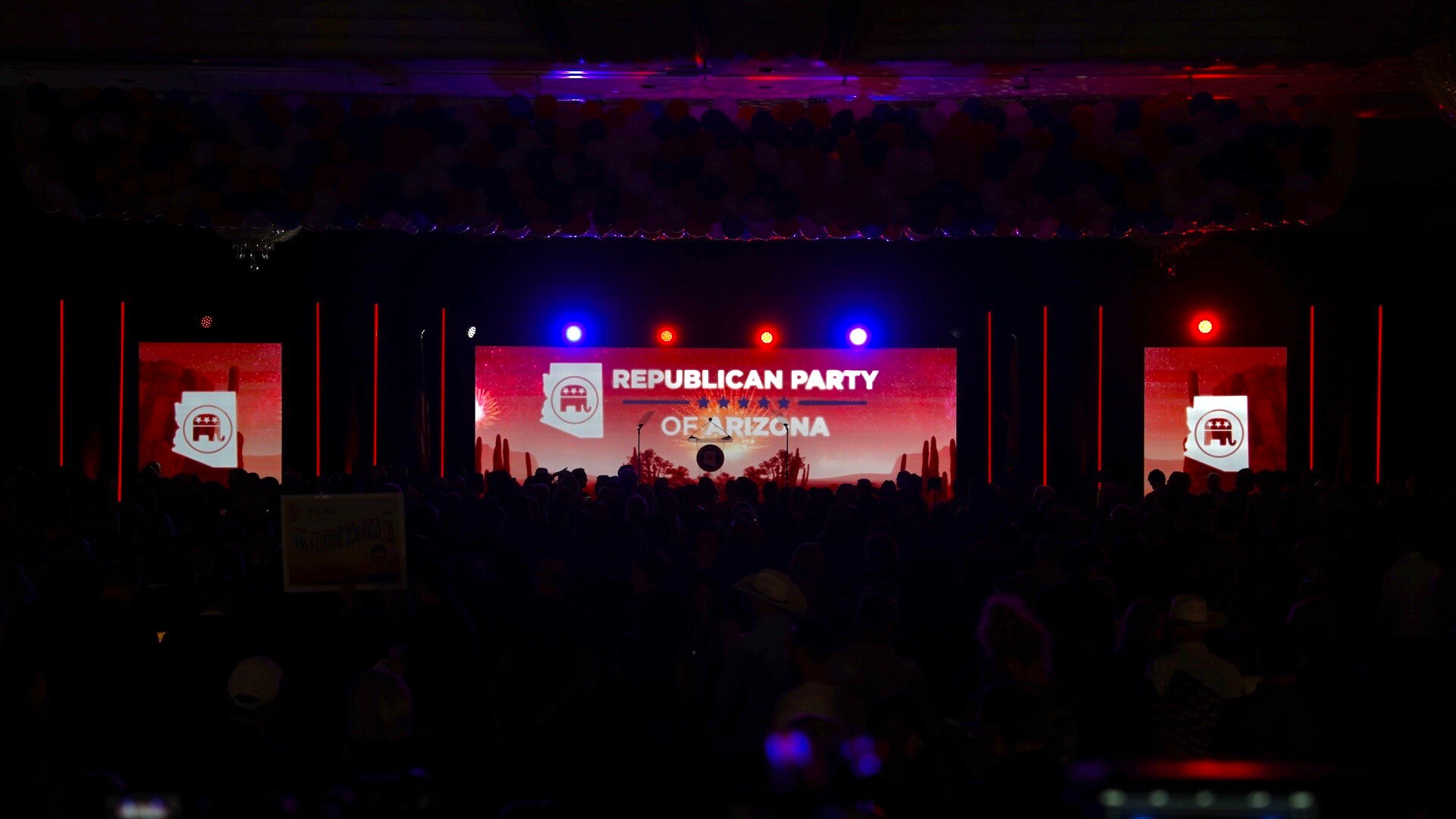 A shot of a ballroom at night with "Republican Party of Arizona" written on the wall