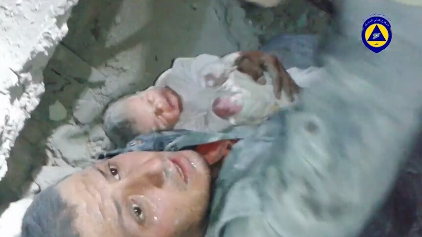 Infant pulled from rubble in Syria