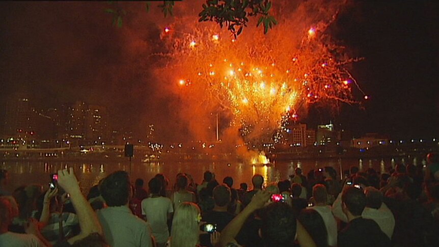 Revellers at Brisbane's South Bank watch new year's eve fireworks display on December 31, 2102