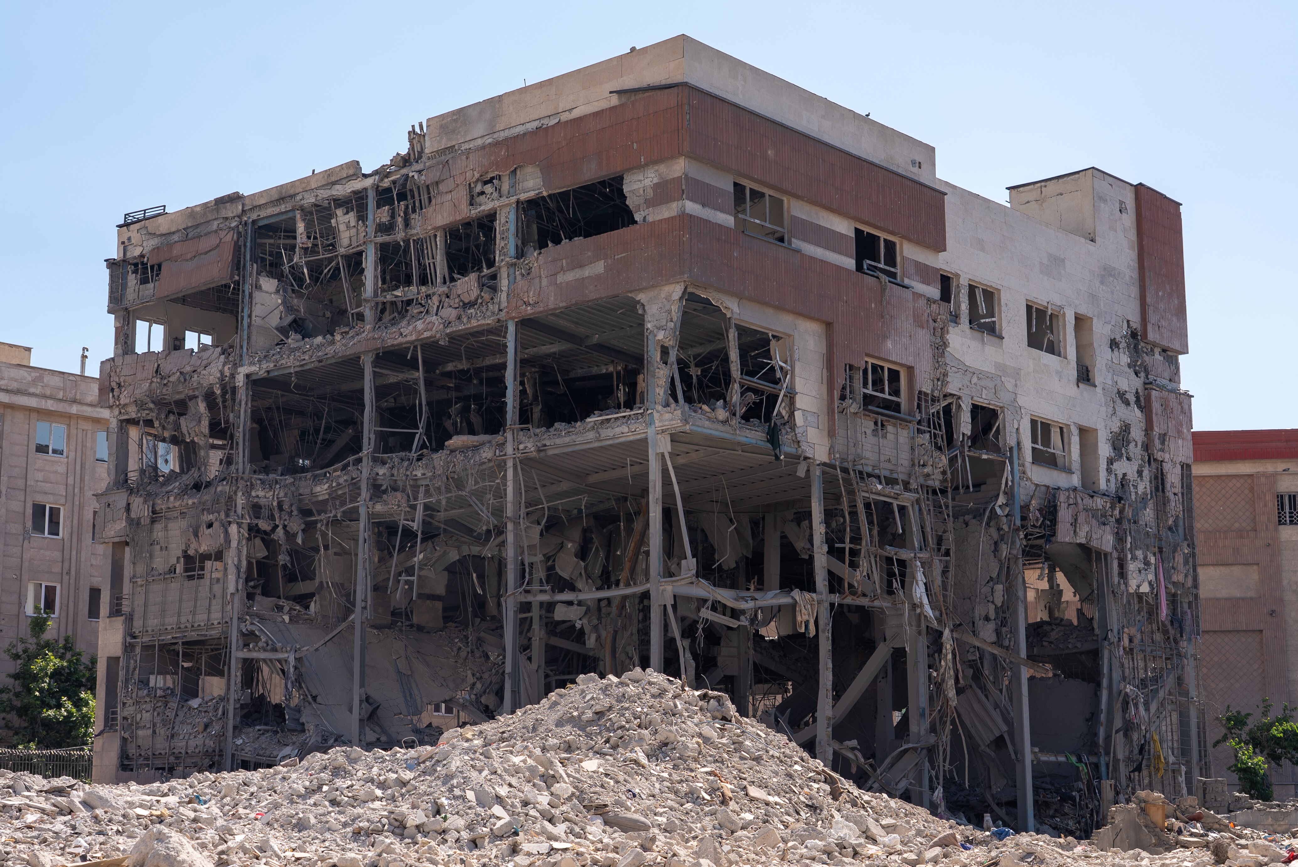 A damaged building destroyed by a military strike.