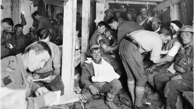 Injured soldiers being treated for injuries in dressing station