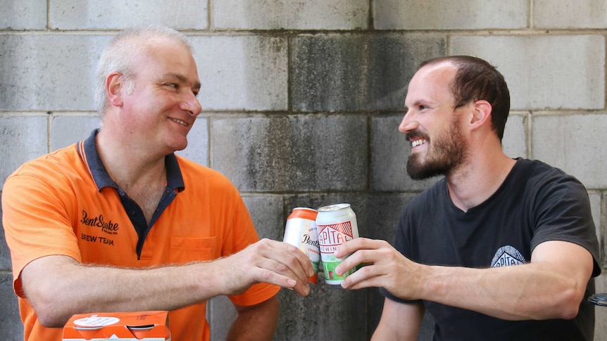 Richard Watkins and Adrian Graeber share a beer.