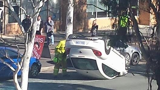 Car flipped on Lysaght Street in Mitchell