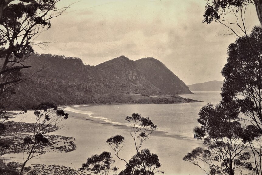 Sepia toned photograph of a small bay.
