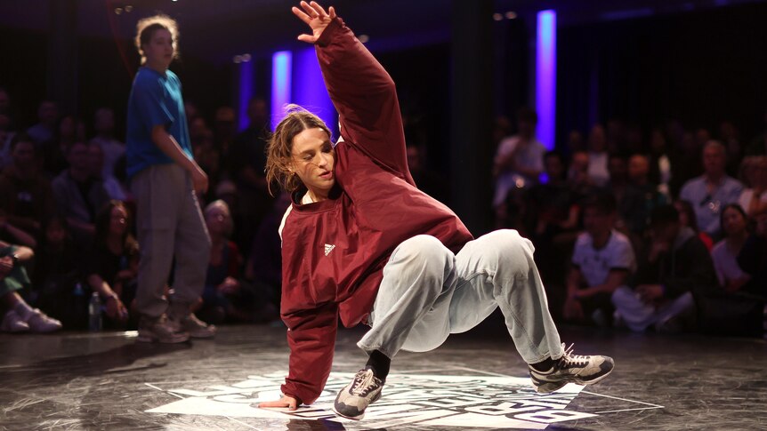 A woman performs during a breakdancing competition
