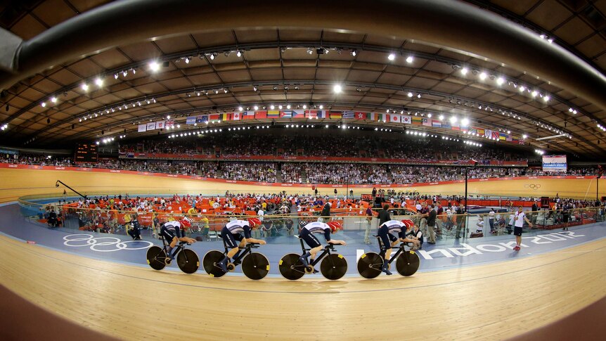 Britain's track cycling men's team pursuit cycle to the gold medal.