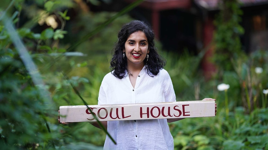 Daizy Mann with Soul House sign after opening a wellness centre for South Asian women in need