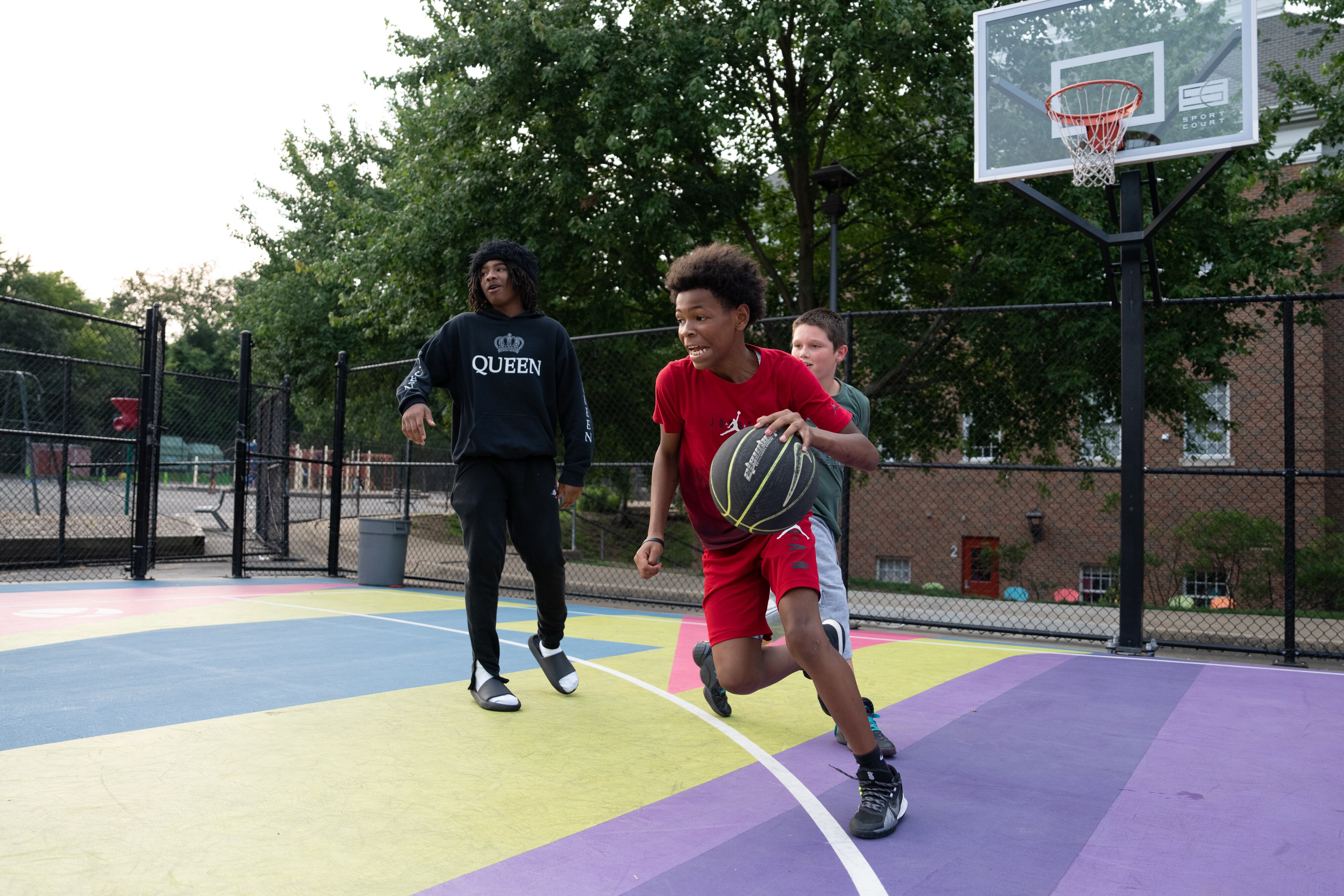A young man dribbles the ball.
