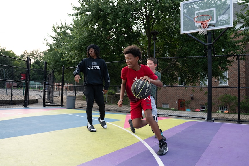 A young man dribbles the ball.