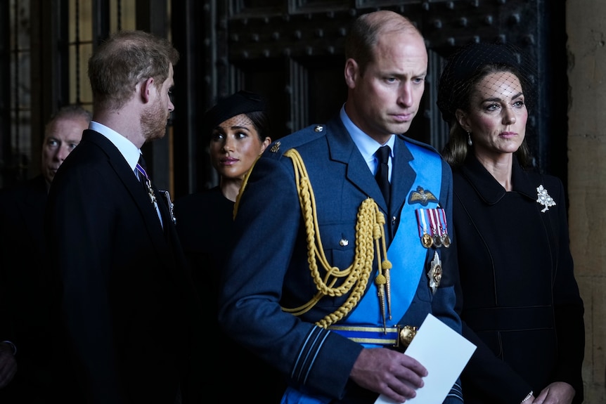 Prince William, Kate, Princess of Wales, Prince Harry, and Meghan at the Queen's funeral.