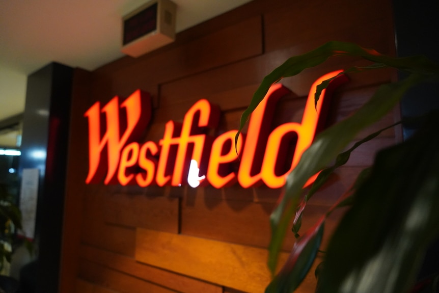 A neon sign reading 'Westfield'