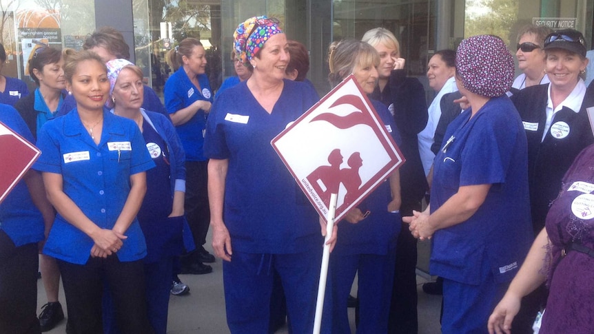 Hospital staff protest over budget cuts