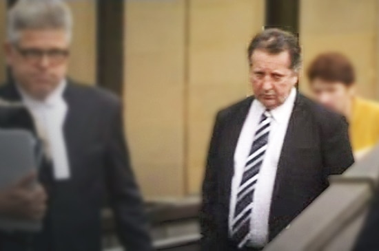 Sean Peter Burk leaves court in Hobart.