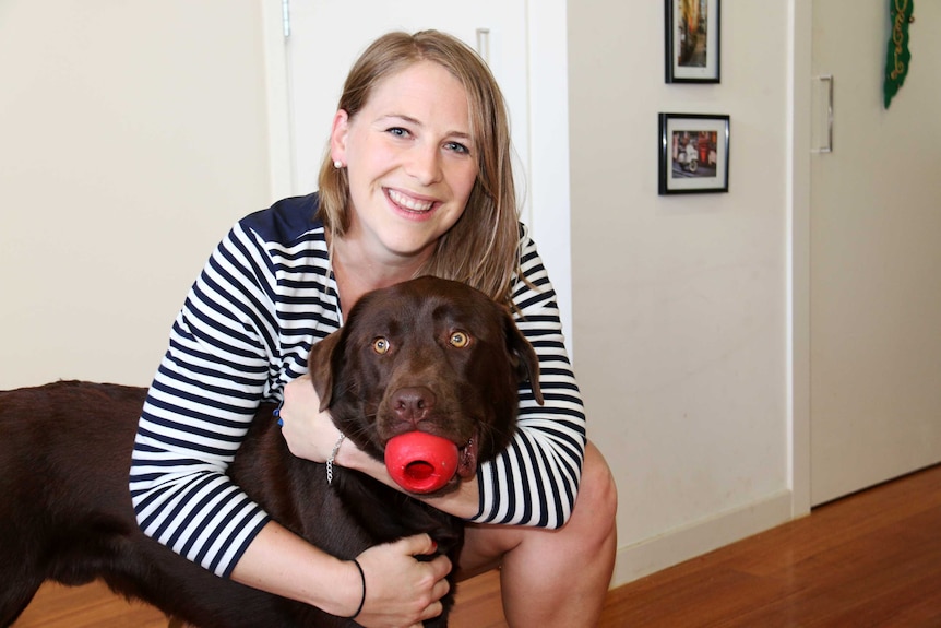 Caroline Campbell and her brown Labrador Frank