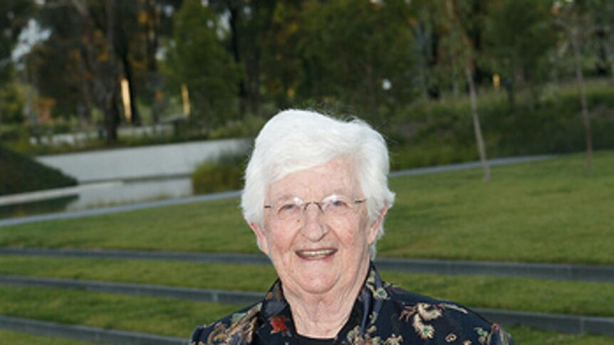 Women's advocate Marie Coleman holding her ACT Senior Australian of the Year award