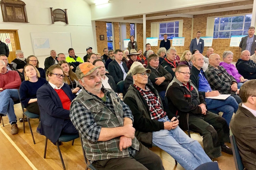 About 50 people are sitting in a community hall to talk about the offshore wind farm proposal