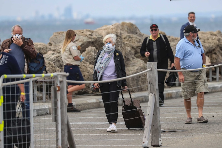 Vasco Da Gama passengers, some wearing masks, at Rottnest jetty