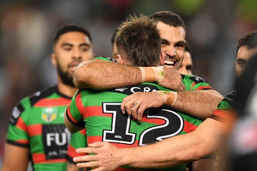 Greg Inglis of the Rabbitohs celebrates the try of Angus Crichton against Wests Tigers.