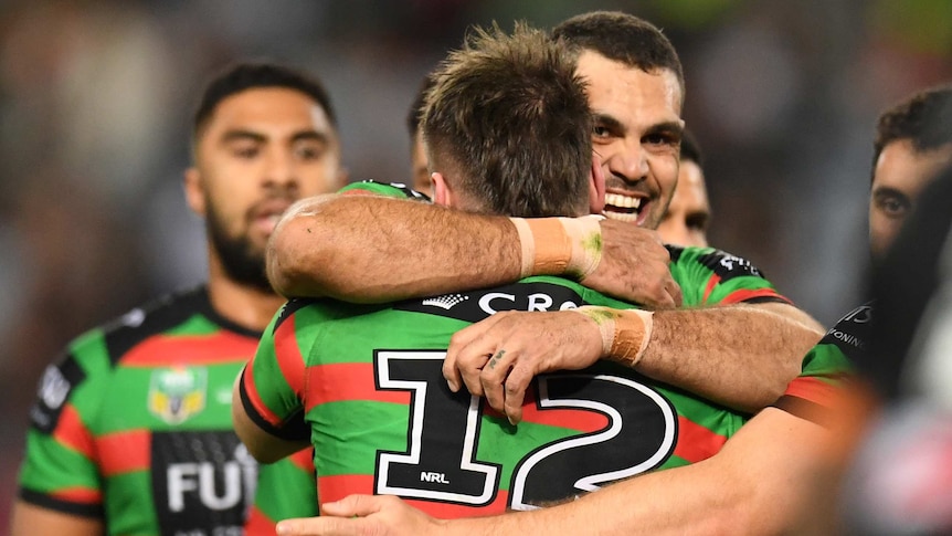 Greg Inglis of the Rabbitohs celebrates the try of Angus Crichton against Wests Tigers.