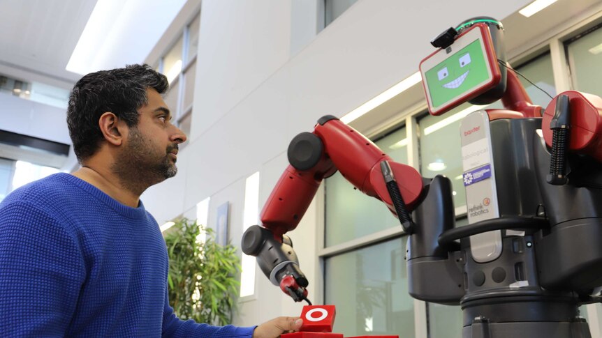 University of Canberra researcher Damith Herath playing Tic Tac Toe with Baxter the Robot