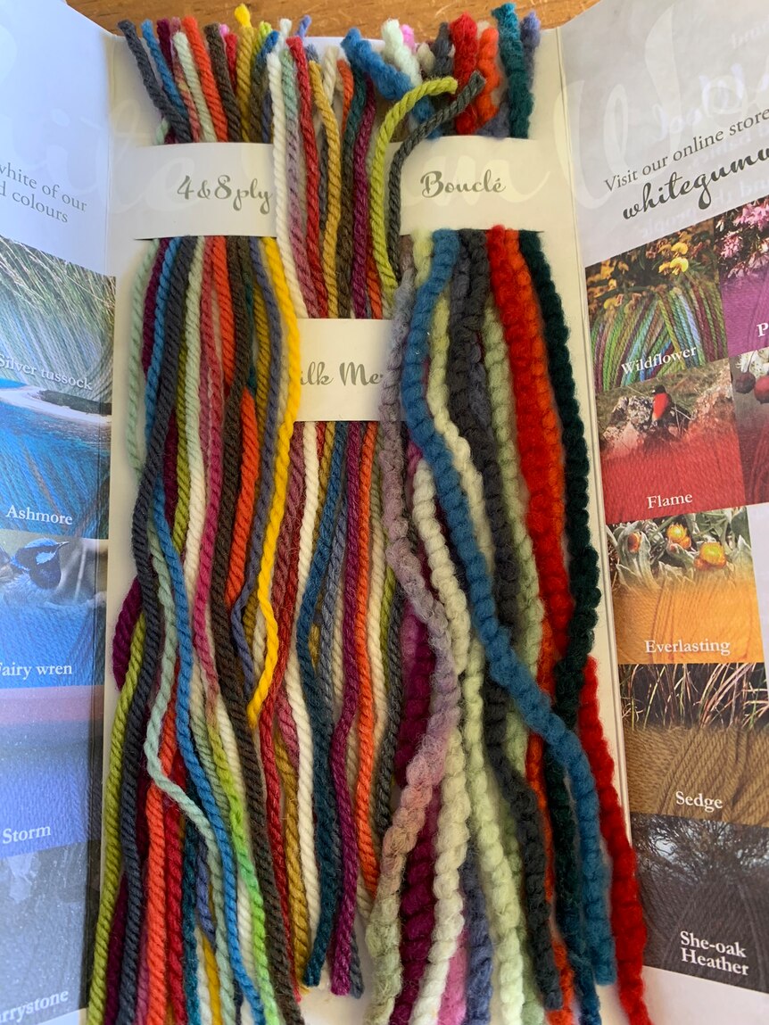 Photo of strands of coloured wool yarn.