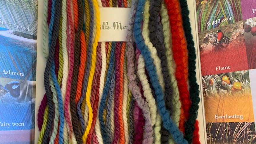 Photo of strands of coloured wool yarn.