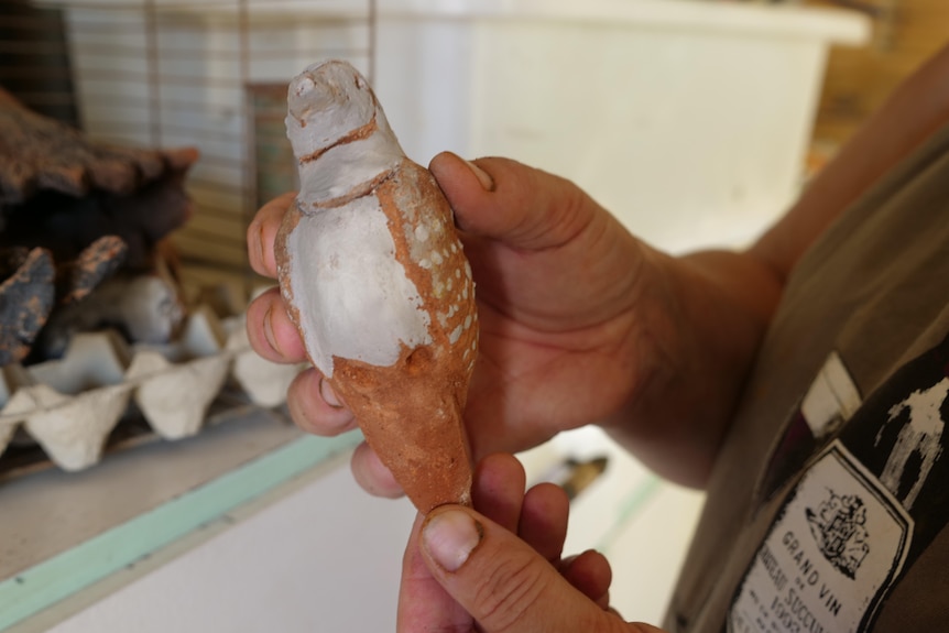 A small bird made out of clay